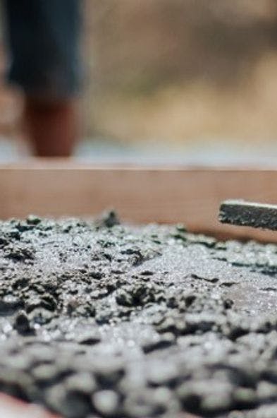 Image of construction workers levelling concrete